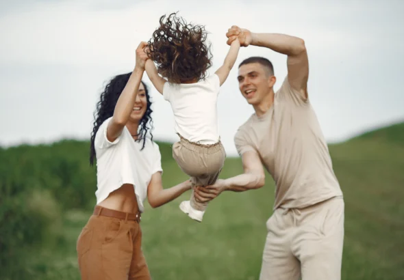 family-with-little-daughter-spending-time-together-sunny-field