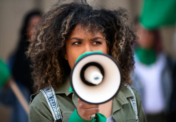 medium-shot-woman-protesting-outdoors