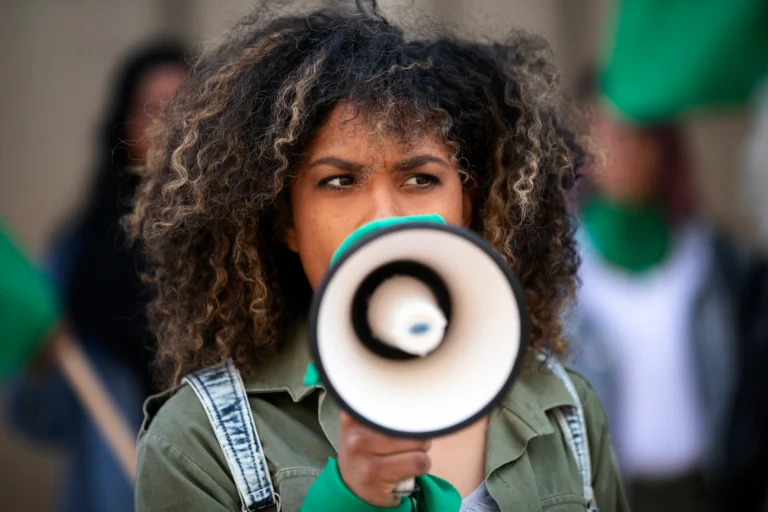 medium-shot-woman-protesting-outdoors